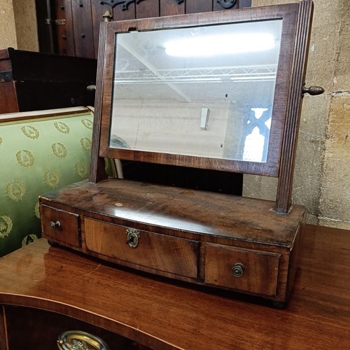 972 - A mahogany serpentine sideboard, 122 cm wide, two bedroom mirrors, a corner cabinet, and five chairs... 