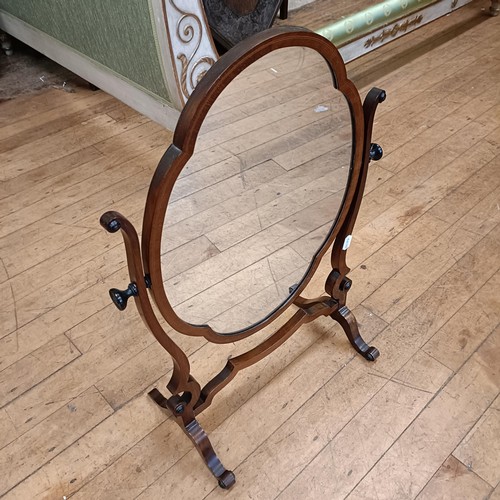 972 - A mahogany serpentine sideboard, 122 cm wide, two bedroom mirrors, a corner cabinet, and five chairs... 