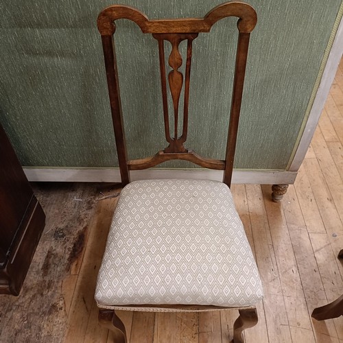 972 - A mahogany serpentine sideboard, 122 cm wide, two bedroom mirrors, a corner cabinet, and five chairs... 