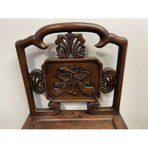 877 - A Chinese carved hardwood single chair