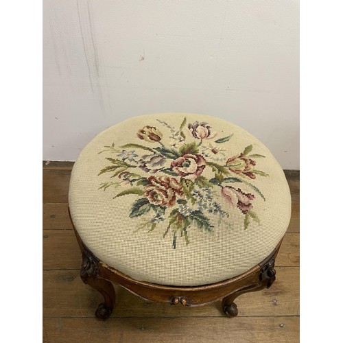 985 - A walnut stool, with a tapestry seat, 50 cm diameter