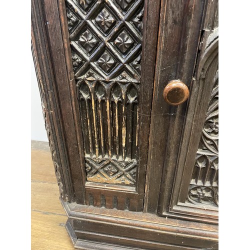 895 - A Gothic oak side cabinet, with a later marble top, 80 cm high x 71 cm wide