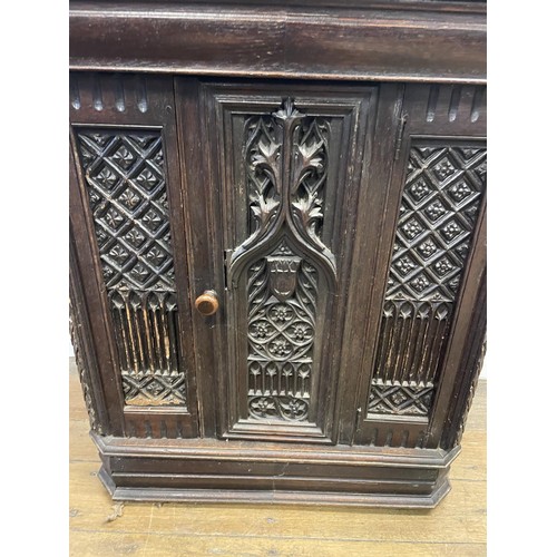 895 - A Gothic oak side cabinet, with a later marble top, 80 cm high x 71 cm wide