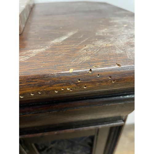 895 - A Gothic oak side cabinet, with a later marble top, 80 cm high x 71 cm wide