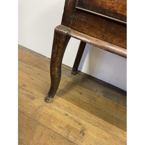 873 - A George III oak dresser base, having three drawers, 178 cm wide