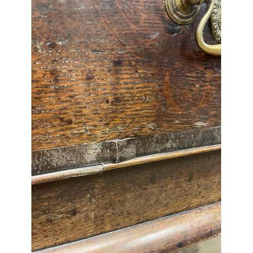 873 - A George III oak dresser base, having three drawers, 178 cm wide