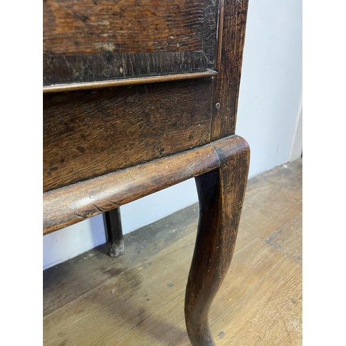 873 - A George III oak dresser base, having three drawers, 178 cm wide