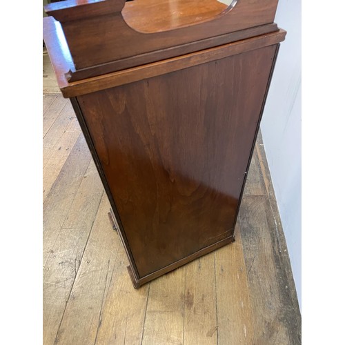 39 - An Art Nouveau style mahogany music cabinet, with a marquetry inlaid decoration, 47 cm wide, and a w... 