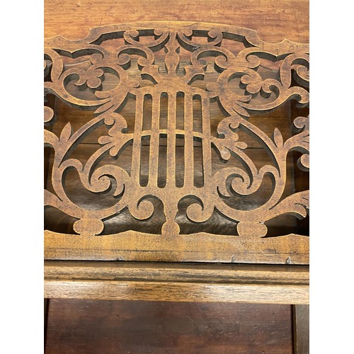 39 - An Art Nouveau style mahogany music cabinet, with a marquetry inlaid decoration, 47 cm wide, and a w... 