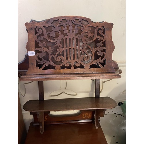 39 - An Art Nouveau style mahogany music cabinet, with a marquetry inlaid decoration, 47 cm wide, and a w... 