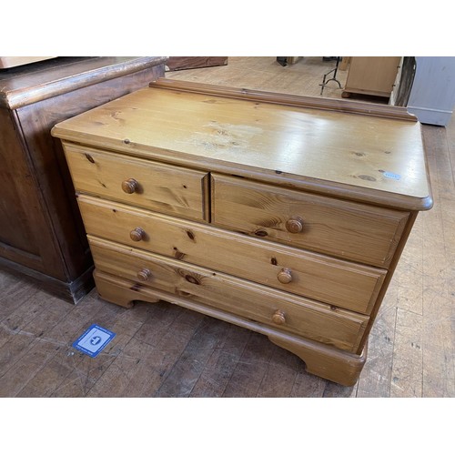 940 - A pair of pine bedside chests, a coffee table, a chest, a bedside table, a stool, and a dresser (7)