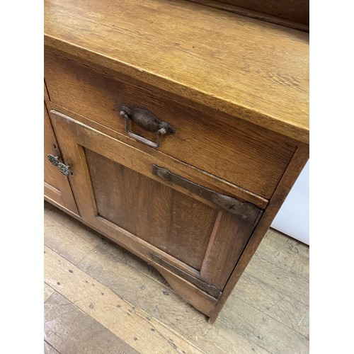 23 - A Liberty's style oak dresser, 137 cm wide