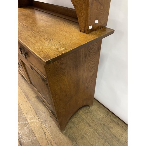 23 - A Liberty's style oak dresser, 137 cm wide