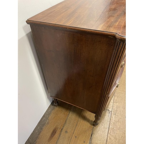 906 - A George III mahogany bow front chest, of three drawers, flanked by reeded column supports, 88 cm hi... 