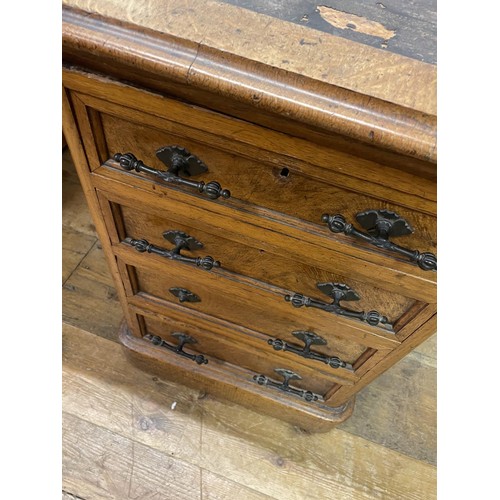 908 - An early 20th century oak pedestal desk, having eight drawers, 150 cm wide