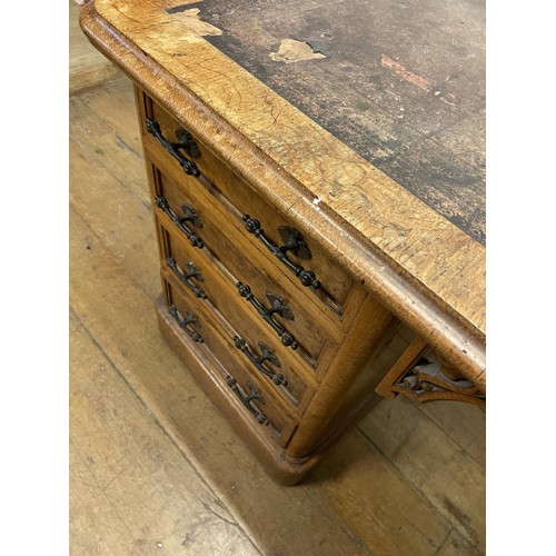 908 - An early 20th century oak pedestal desk, having eight drawers, 150 cm wide