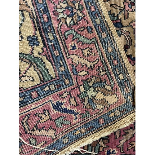 986 - A Persian cream ground carpet, 208 x 131 cm