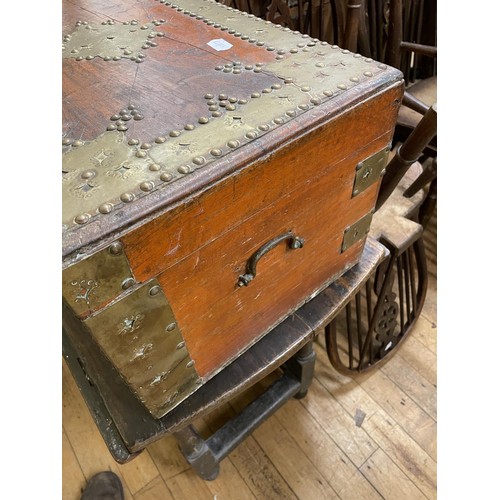 964 - A Zanzibar style brass bound and decorated chest, 58 cm wide