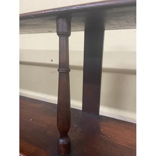 953 - A mahogany waterfall front hanging shelf, 120 cm wide