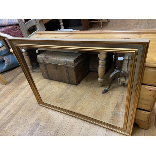 949 - A gilt framed wall mirror, 92 x 110 cm, and a pine dressing table, 150 cm (2)