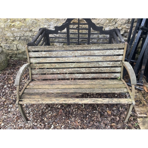 1005 - A Lutyens style garden bench, 136 cm wide, and another garden bench (2)