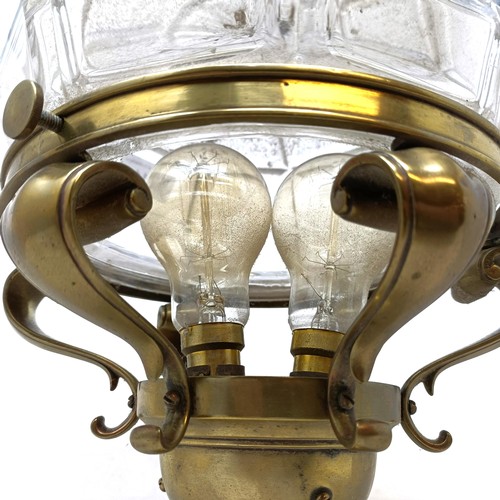 811 - A brass and glass wall light, 24 cm diameter