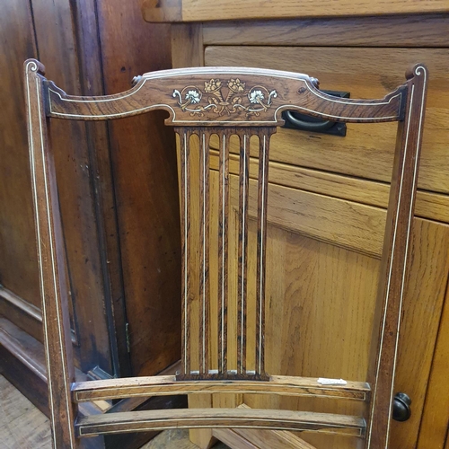 866 - A light oak sideboard, having three drawers and three cupboard doors, 141 cm wide, two chairs, three... 