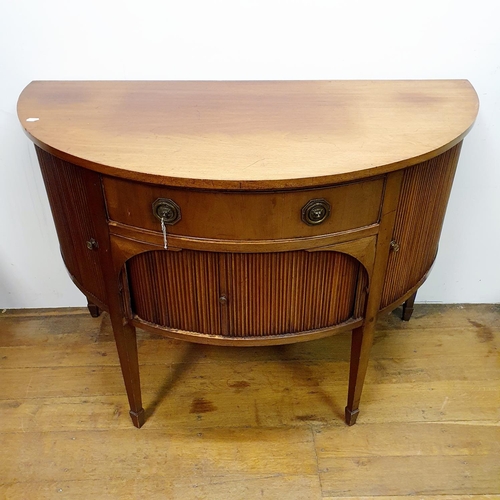 868 - A mahogany demi lune sideboard, with tambour fronted cupboards, 135 cm wide