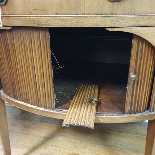 868 - A mahogany demi lune sideboard, with tambour fronted cupboards, 135 cm wide