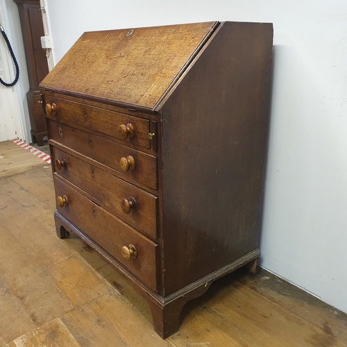 875 - A 19th century oak bureau, 92 cm wide