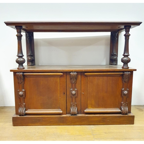 879 - A mahogany buffet, the base with two cupboard doors, 130 cm wide