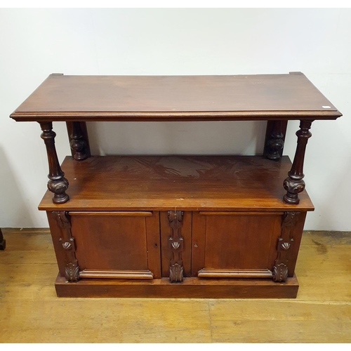 879 - A mahogany buffet, the base with two cupboard doors, 130 cm wide