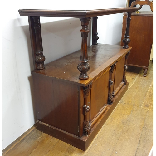 879 - A mahogany buffet, the base with two cupboard doors, 130 cm wide