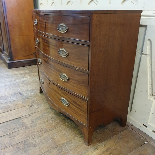 882 - A mahogany bow front chest, having two short and three long drawers, 110 cm wide