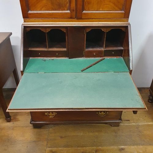 894 - A mahogany bureau bookcase, 84 cm wide