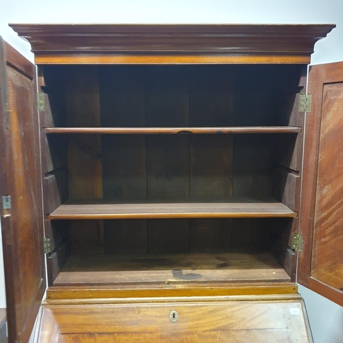 894 - A mahogany bureau bookcase, 84 cm wide