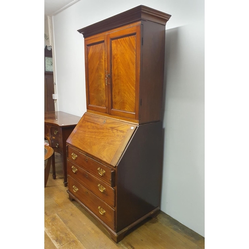 894 - A mahogany bureau bookcase, 84 cm wide