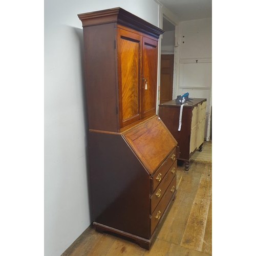 894 - A mahogany bureau bookcase, 84 cm wide