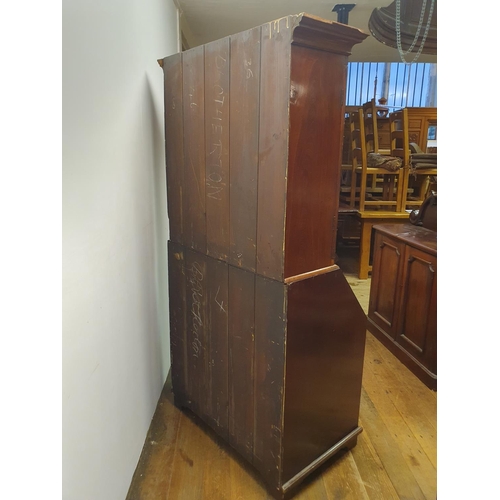 894 - A mahogany bureau bookcase, 84 cm wide