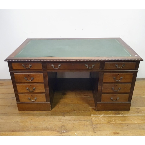 896 - A mahogany pedestal desk, of a nine drawer configuration, 150 cm wide