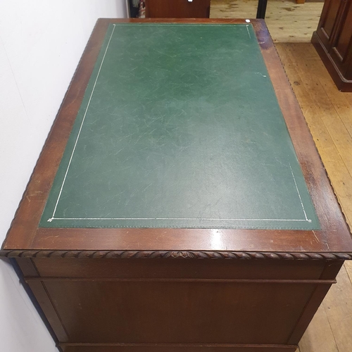 896 - A mahogany pedestal desk, of a nine drawer configuration, 150 cm wide