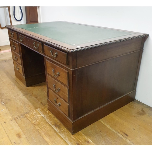 896 - A mahogany pedestal desk, of a nine drawer configuration, 150 cm wide