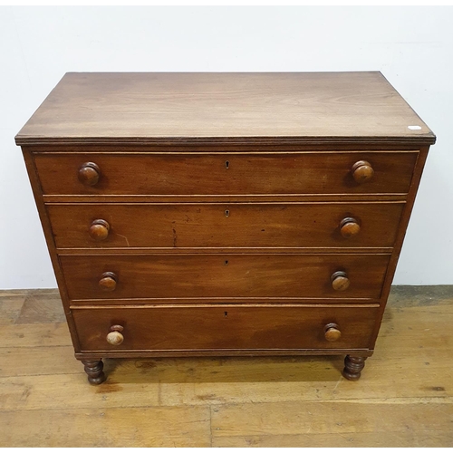 901 - A mahogany chest, having four drawers, on turned feet, 100 cm wide