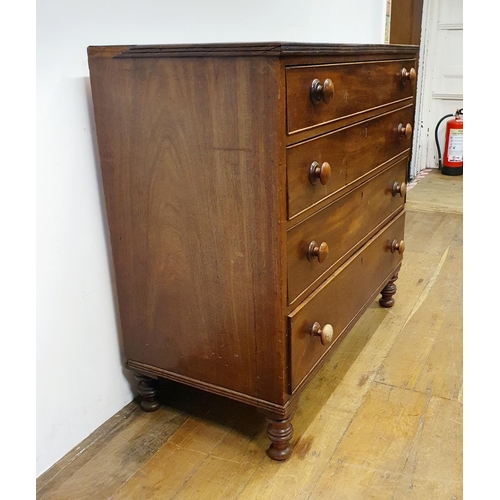 901 - A mahogany chest, having four drawers, on turned feet, 100 cm wide