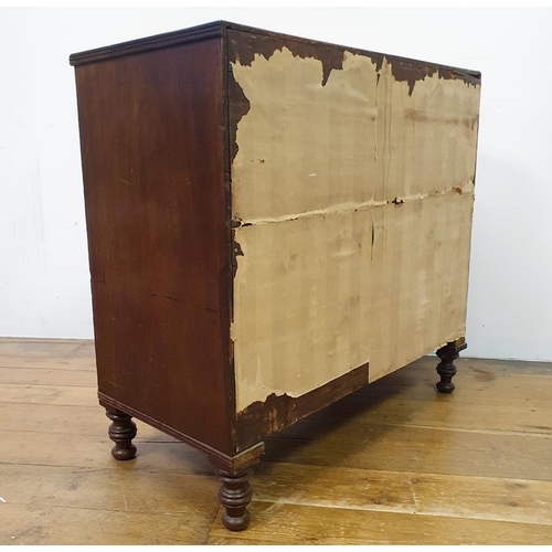 901 - A mahogany chest, having four drawers, on turned feet, 100 cm wide