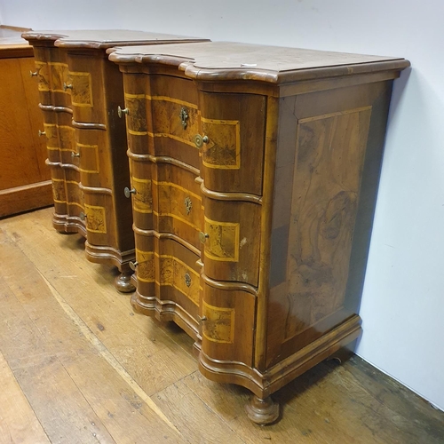 909 - A pair of 19th century Italian walnut bombe chests, of small proportions, with boxwood inlay, having... 