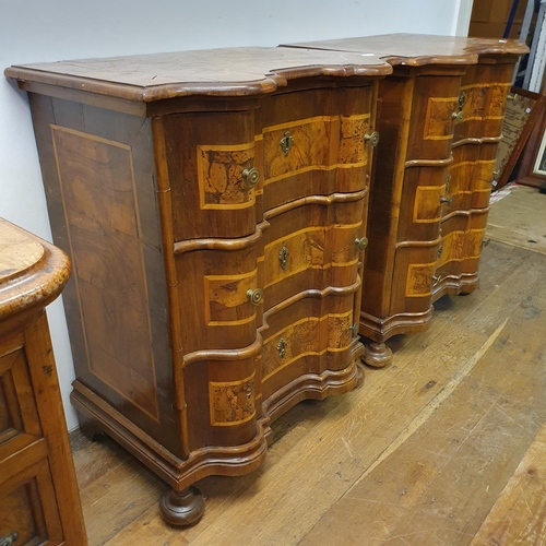 909 - A pair of 19th century Italian walnut bombe chests, of small proportions, with boxwood inlay, having... 