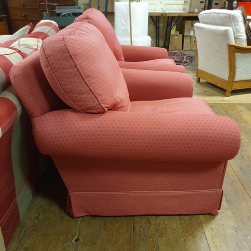 917 - A pair of red upholstered armchairs