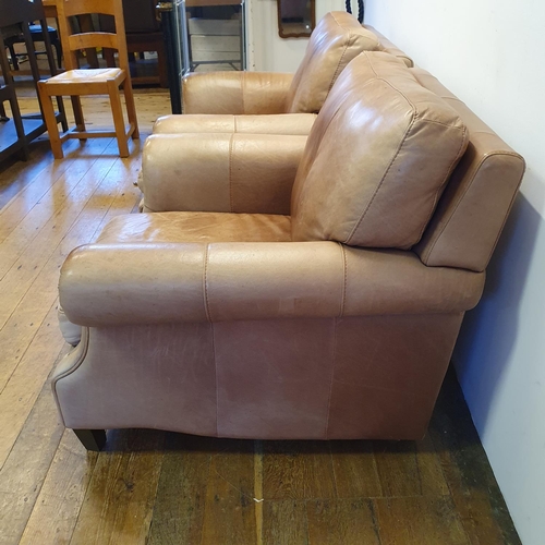 924 - A pair of light brown leather armchairs (2)