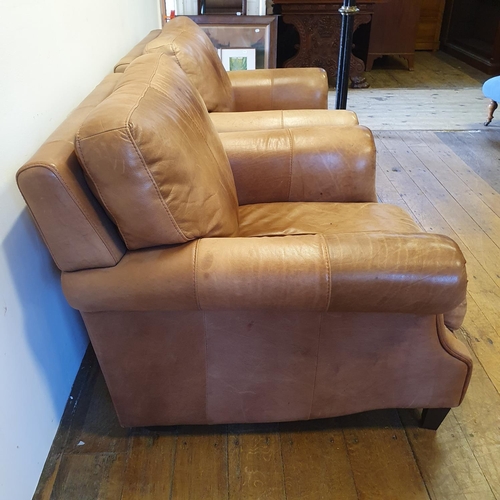 924 - A pair of light brown leather armchairs (2)